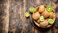 Fresh kiwi fruit in the basket. Royalty Free Stock Photo