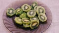 Fresh kiwi fruit on a plate on the table