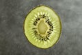 Fresh kiwi fruit slice on blurred background Royalty Free Stock Photo