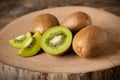 Fresh kiwi fruits on wood