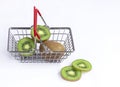 fresh kiwi in a grocery basket on a white background, isolate. Royalty Free Stock Photo