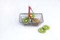 fresh kiwi in a grocery basket on a white background, isolate. Royalty Free Stock Photo