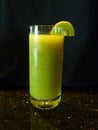 Fresh Kiwi juice isolated on black baground