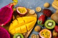 Exotic fruits on wooden chopping board