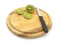 Fresh kiwi sliced with knife, with slices on wooden board Royalty Free Stock Photo