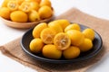 Fresh kumquats fruit on black plate Royalty Free Stock Photo
