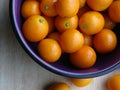 Kumquats on Wooden Cutting Board