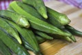 Fresh lady fingers or okra on chopping board Royalty Free Stock Photo