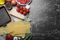 Fresh lasagna ingredients on marble table, flat lay. Space for text