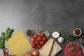 Fresh lasagna ingredients on grey table. Space for text Royalty Free Stock Photo