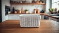 Fresh Laundry Basket With Soft White Interior Resting on a Clean Wooden Surface in a Bright Kitchen Setting Royalty Free Stock Photo
