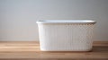Fresh Laundry Basket Placed on Clean Wooden Surface With Soft White Interior in a Bright Setting Royalty Free Stock Photo