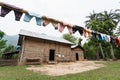 Fresh laundry drying in front of the traditional Laotian bamboo hut in a village near Nong Khiaw, Laos Royalty Free Stock Photo