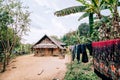 Fresh laundry drying in front of the traditional Laotian bamboo hut in a village near Nong Khiaw, Laos