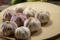 Fresh leek bulbs served on a porcelain plate Royalty Free Stock Photo