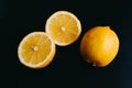 Fresh lemon on black background. two lemons. Royalty Free Stock Photo