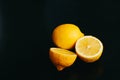 Fresh lemon on black background. two lemons. Royalty Free Stock Photo