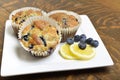 Fresh lemon blueberry muffins on white plate. Royalty Free Stock Photo