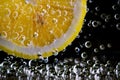 fresh lemon in the bubbles soda Royalty Free Stock Photo