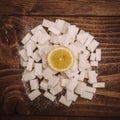 Fresh lemon on bunch of sugar cubes and granulated sugar Royalty Free Stock Photo