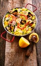 Fresh Lemon and Colorful Seafood Paella Rice Dish Royalty Free Stock Photo