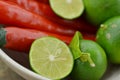 Fresh lemon cut half with chili in bowl on wooden table Royalty Free Stock Photo