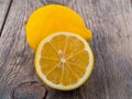 Fresh lemon and cut off half on wooden old table Royalty Free Stock Photo