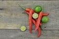 Fresh lemon cut half with chili on wooden background Royalty Free Stock Photo