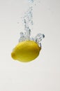 Fresh lemon drop on water with babble Royalty Free Stock Photo