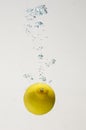 Fresh lemon drop on water with babble Royalty Free Stock Photo