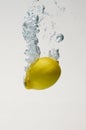 Fresh lemon drop on water with babble Royalty Free Stock Photo