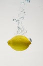 Fresh lemon drop on water with babble Royalty Free Stock Photo