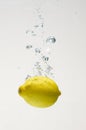 Fresh lemon drop on water with babble Royalty Free Stock Photo