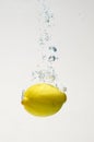 Fresh lemon drop on water with babble Royalty Free Stock Photo