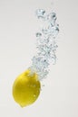 Fresh lemon drop on water with babble Royalty Free Stock Photo