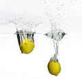 Fresh lemon dropped into water Royalty Free Stock Photo