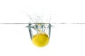 Fresh lemon dropped into the water with water splash on a white Royalty Free Stock Photo