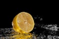 Fresh lemon water. Isolated on black background