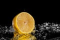 Fresh lemon water. Isolated on black background