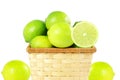 Fresh lemon lime citrus fruit in bamboo basket in white background Royalty Free Stock Photo