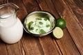 Fresh lemon and lime homemade ice cream in a white cup of milk Royalty Free Stock Photo