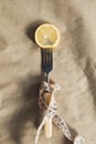 Fresh lemon slice on a fork with measuring tape Royalty Free Stock Photo