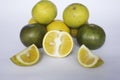 fresh lemon slice, orange slice,, citrus sinensis, green lemon, yellow lemon in white background