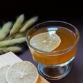 fresh lemon tea served in a glass with a lemon wedge Royalty Free Stock Photo