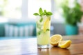 fresh lemonade in a glass with sliced lemons and mint leaves Royalty Free Stock Photo