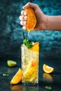 Fresh lemonade with mint, ginger, orange and ice in glass jar on the dark blue background Royalty Free Stock Photo