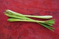 Lemongrass bundle on red background.