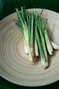 Fresh Lemongrass Cymbopogon citratus or citronella, serai on a wooden plate Royalty Free Stock Photo