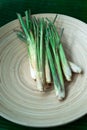 Fresh Lemongrass Cymbopogon citratus or citronella, serai on a wooden plate