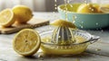 Fresh lemons being squeezed with juice splashing in bright kitchen setting during daytime Royalty Free Stock Photo